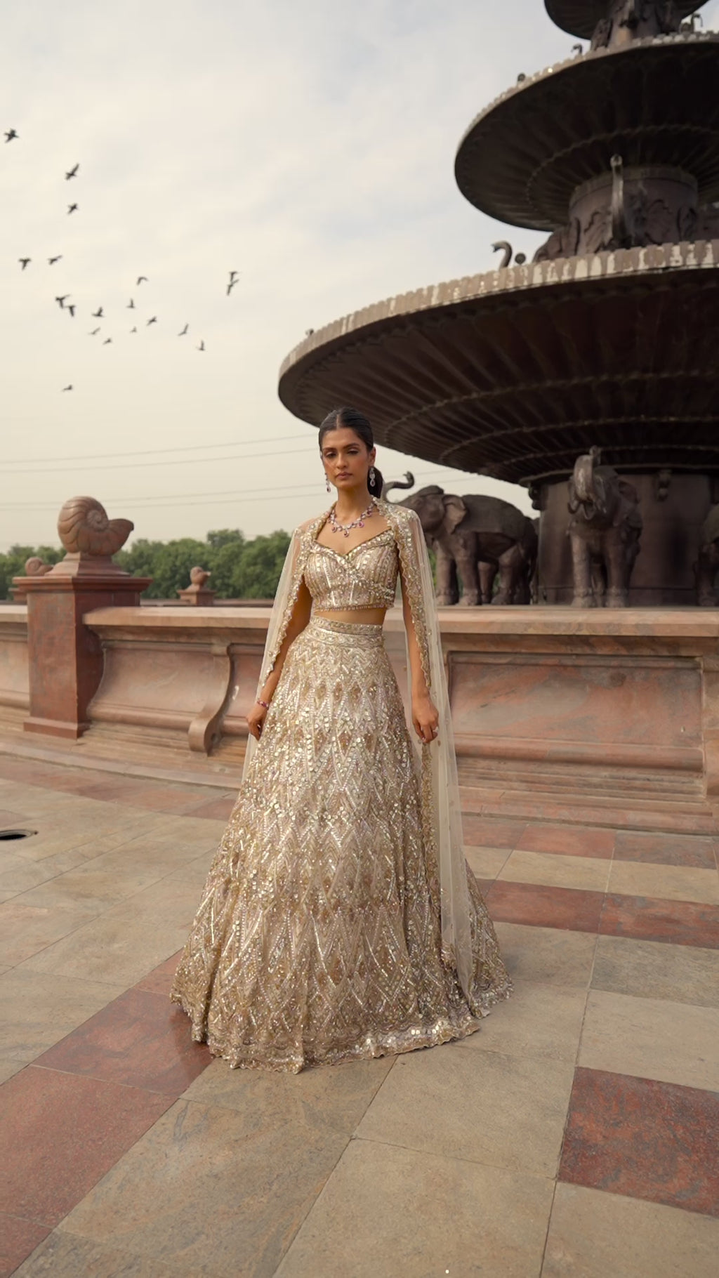 Nude Tulle Lehenga Choli with worked Belt and contrasting Organza Dupatta with an Optional Tulle Veil